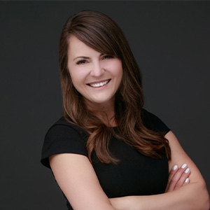 Headshot photo of Jenn Hasselmann.