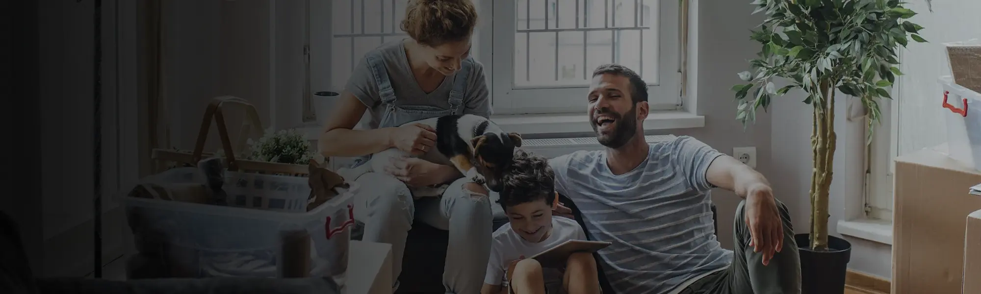 A family sitting together on the couch.