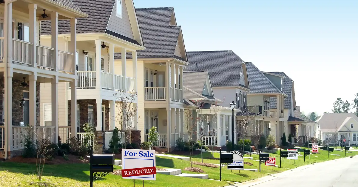 Houses with "For Sale" signs