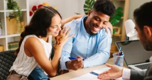 Man and woman discussing business with advisor