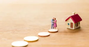 Toy couple and house
