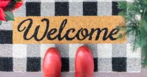 Red boots on a welcome mat
