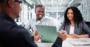 Agent meeting with smiling couple