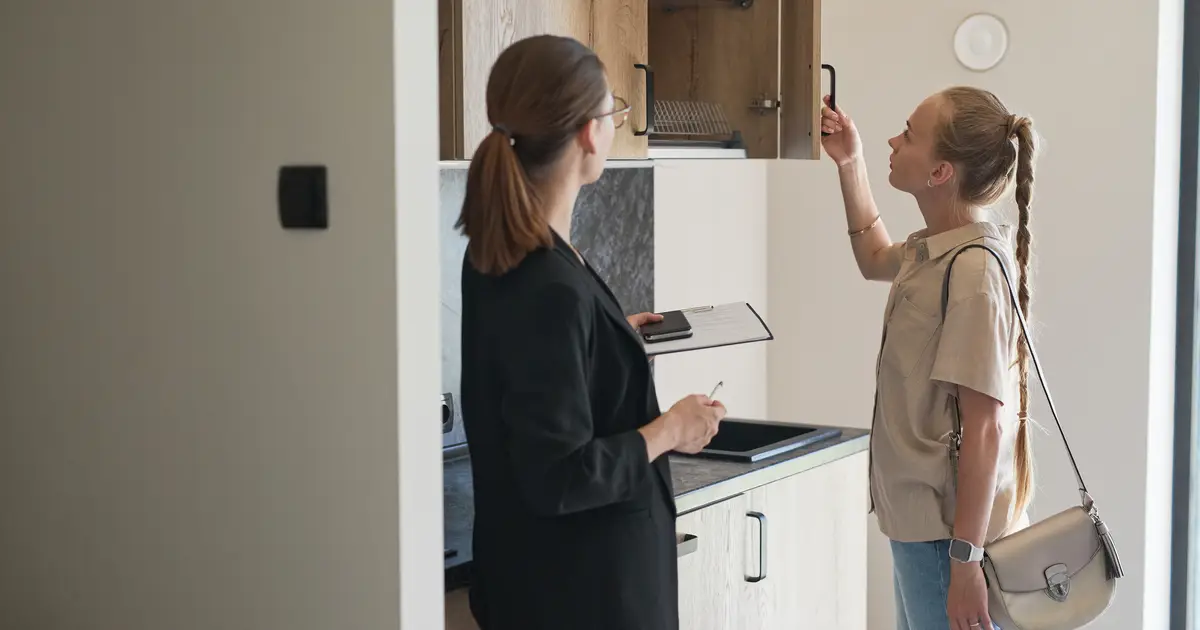 woman viewing a home with an agent
