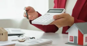 closeup of hands on calculator