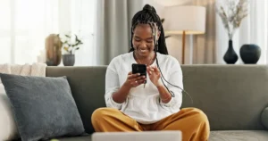 Smiling woman looking at cell phone