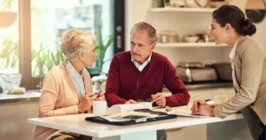 agent conversing with retired couple